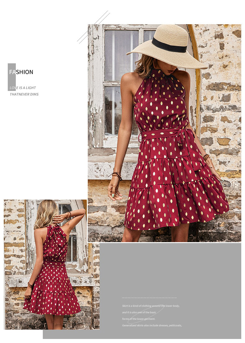 Front view of the Golden Hour burgundy wine halter mini dress with metallic gold dots, self-tie waist and tiered skirt.