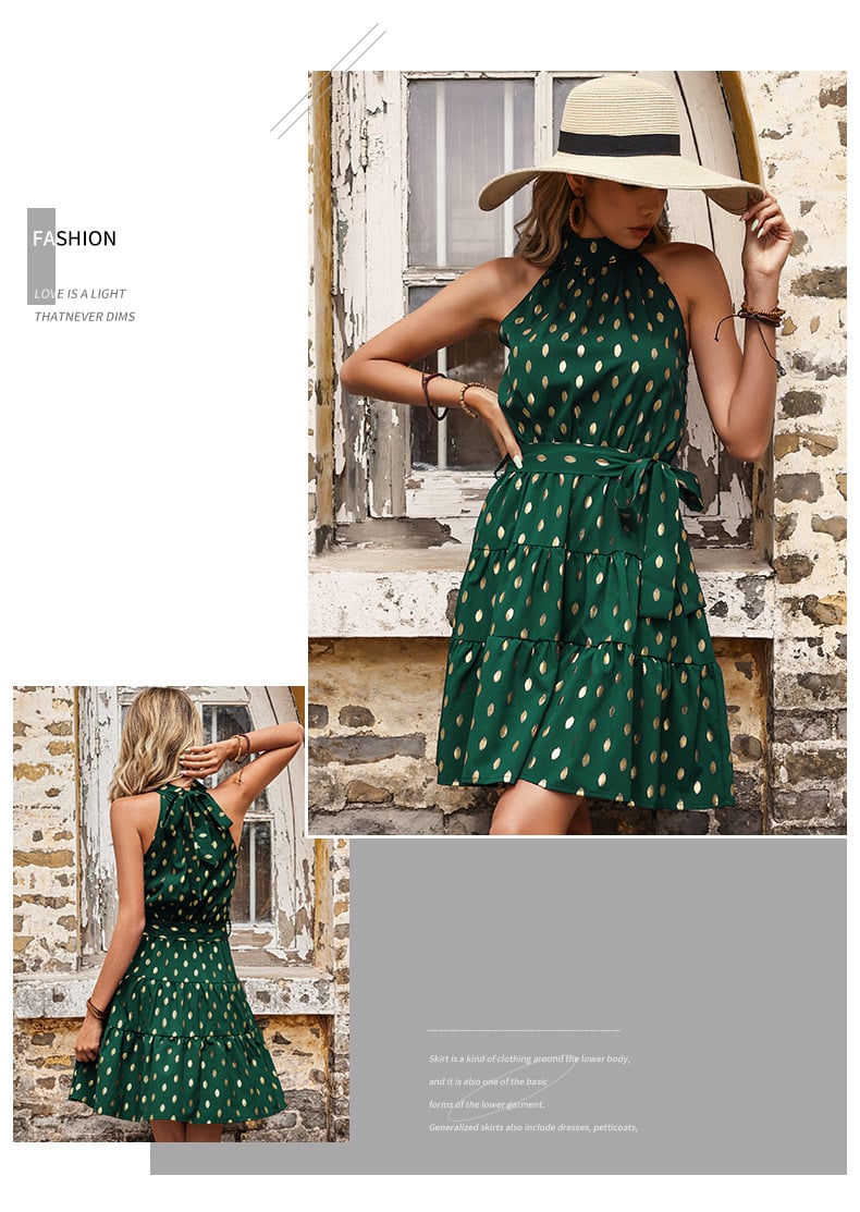 Front view of the Golden Hour emerald green halter mini dress with metallic gold dots, tie waist and tiered A-line skirt.